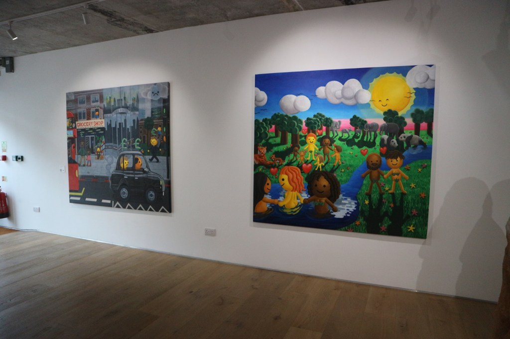 Two large paintings are hung on a white wall next to each other. The left is a gloomy cartoonish london scene, and the right is a happy sunny landscape with smiling characters in the same style.